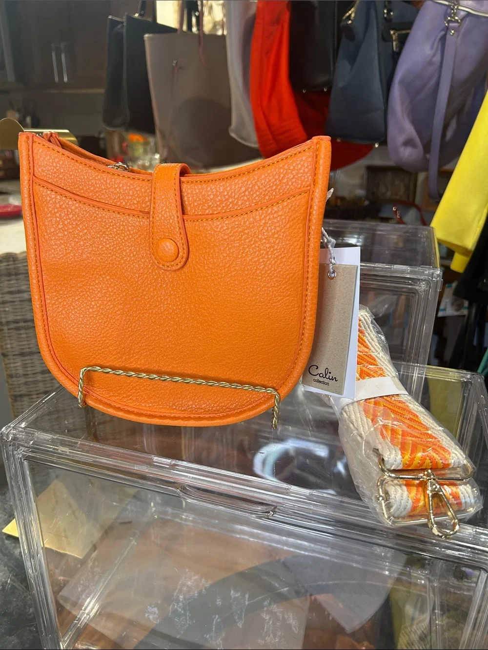 Calin Orange Pebbled Vegan Leather Crossbody with Guitar Strap 8”x 2.25”x 7” NWT